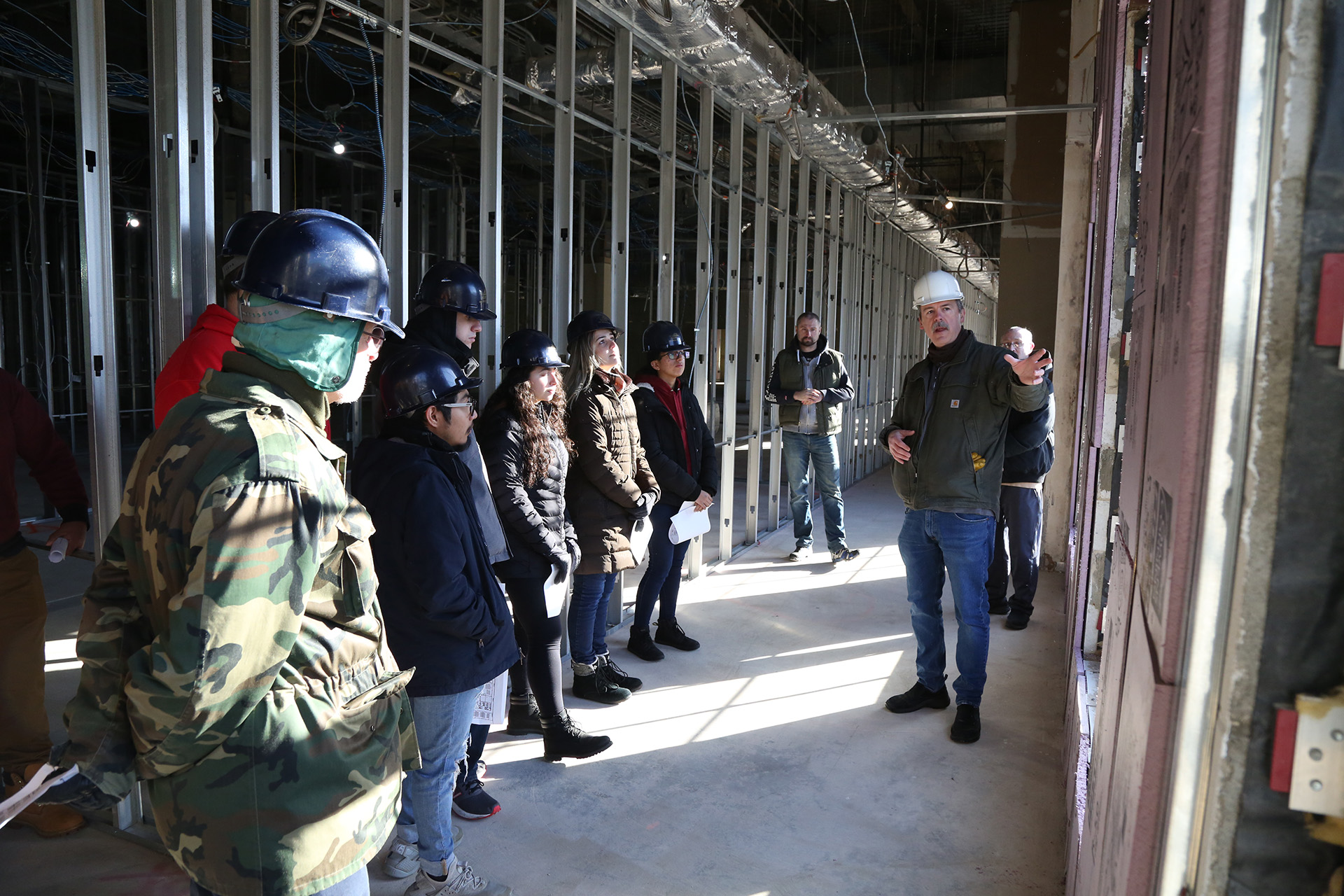 Students learning about construction on site.
